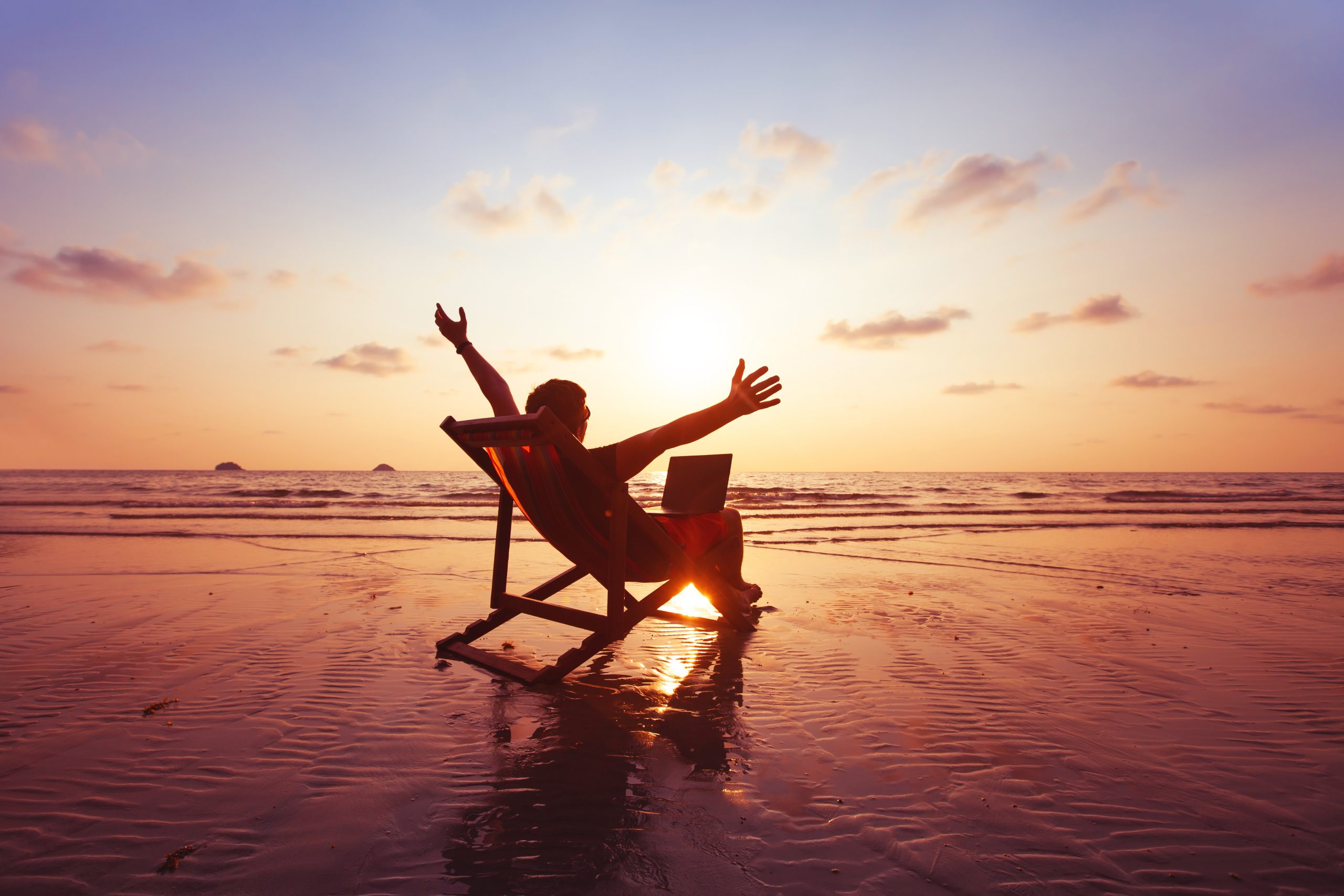 http://Freelancer%20With%20Laptop%20Computer%20Working%20On%20The%20Beach,%20Freelance%20Work